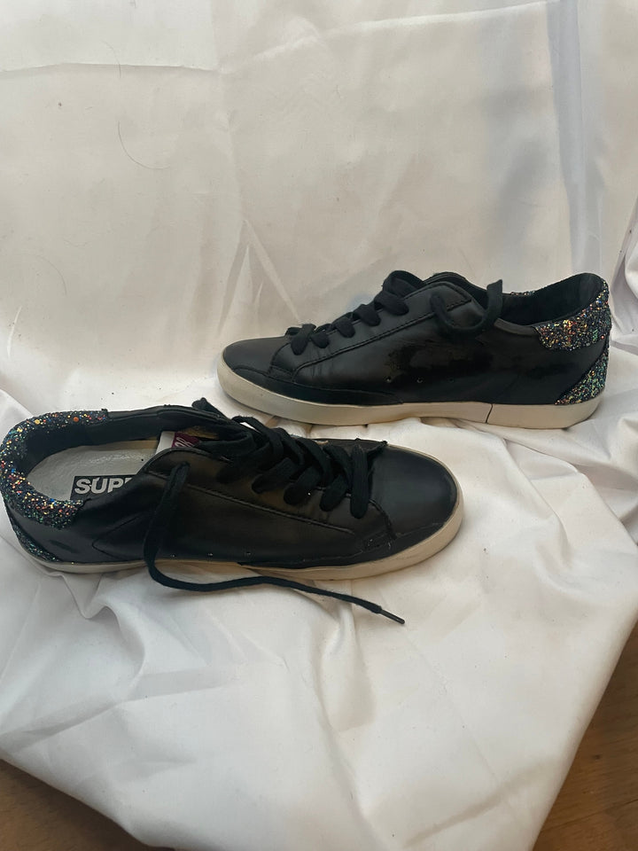 Golden Goose Super-Star low-top leather sneakers in black with a contrasting blue star and glitter heel tab. Size 37 Women&