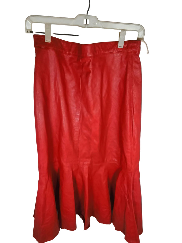 Vintage 1980s Christian Lauren red leather trumpet skirt featuring a midi length. Size 13/14