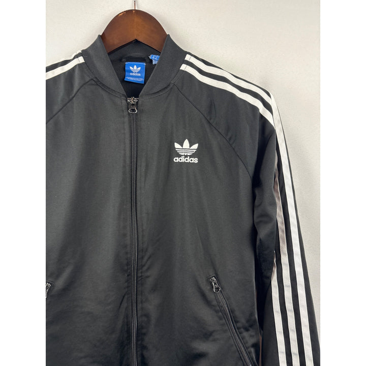 Women’s  Adidas Medium Black Windbreaker w/ White Stripes & Logo on Back