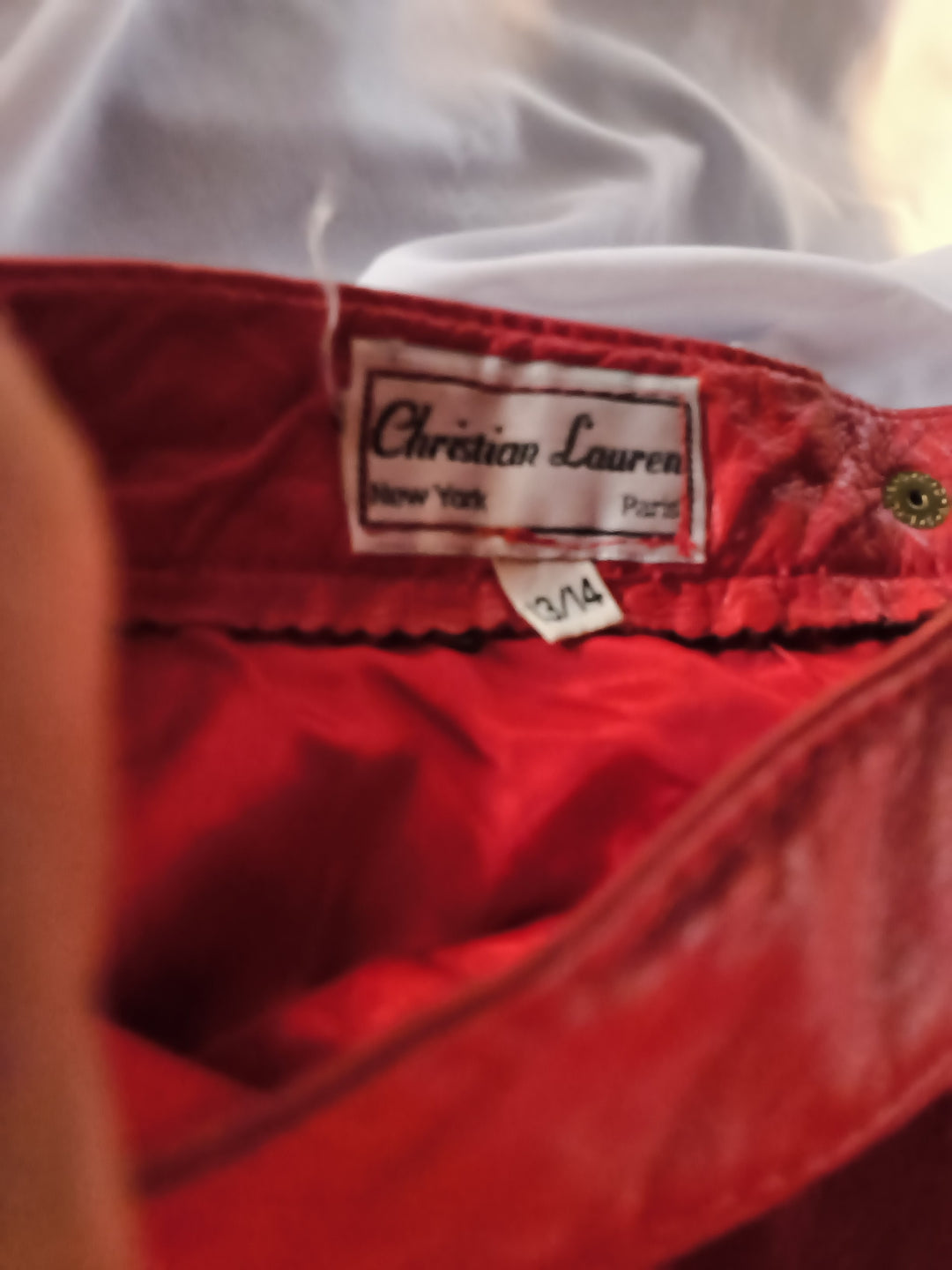 Vintage 1980s Christian Lauren red leather trumpet skirt featuring a midi length. Size 13/14